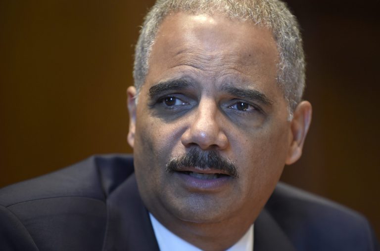 Attorney General Eric Holder speaks during an interview with The Associated Press at the Justice Department in Washington, Tuesday, Sept. 16, 2014. Broadening its push to improve police relations with minorities, the Justice Department has enlisted a team of criminal justice researchers to study racial bias in law enforcement in five American cities and recommend strategies to address the problem nationally, Holder said Tuesday. (AP Photo/Susan Walsh)