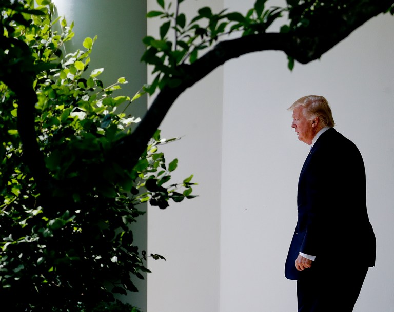 As Trump embarked on his first foreign trip, he left behind a full week of scandals and a Russia investigation that increasingly has the White House under siege. (AP Photo/Pablo Martinez Monsivais)
