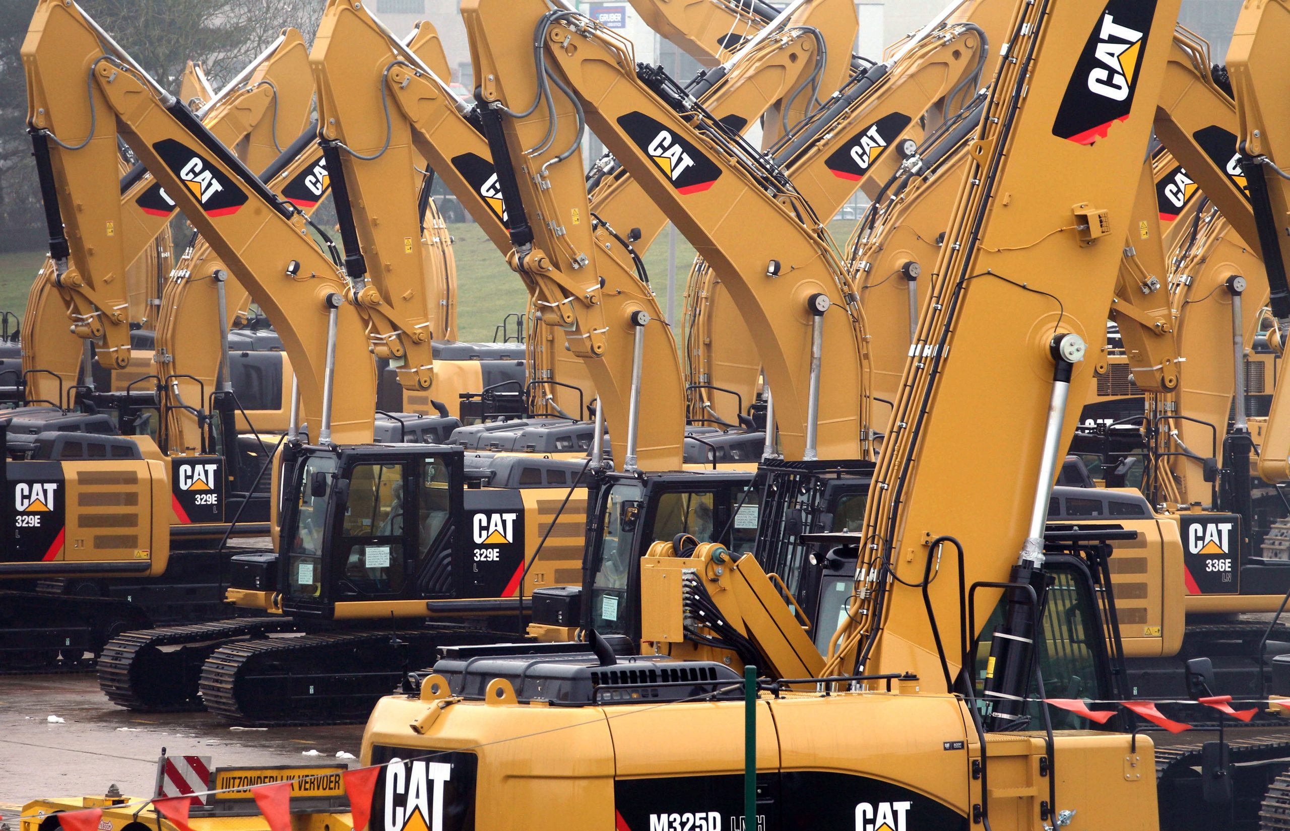 Armed with a lower tax rate, Caterpillar hikes quarterly dividends