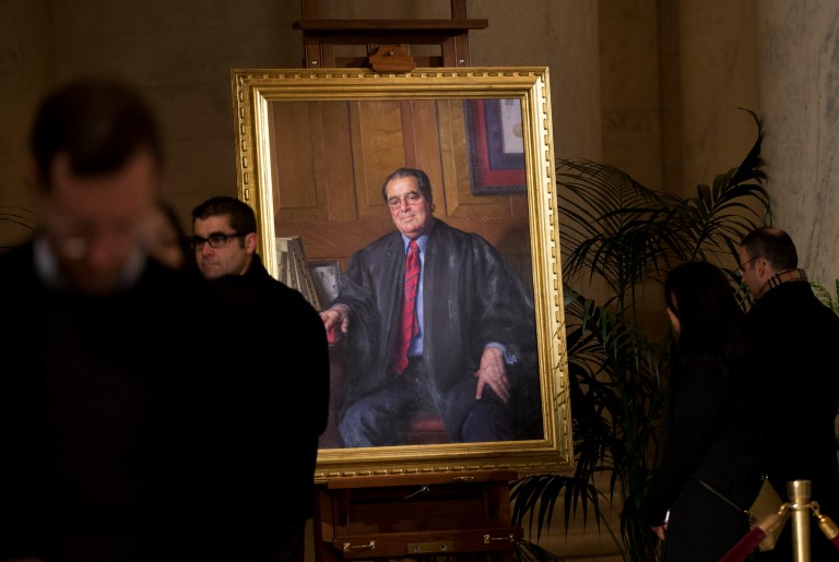 Justice Scalia's views -- passionately felt and pungently expressed though they were -- now seem like so many boats against the current, borne back ceaselessly into the past," wrote Jeffrey Toobin. (AP Photo/Manuel Balce Ceneta)