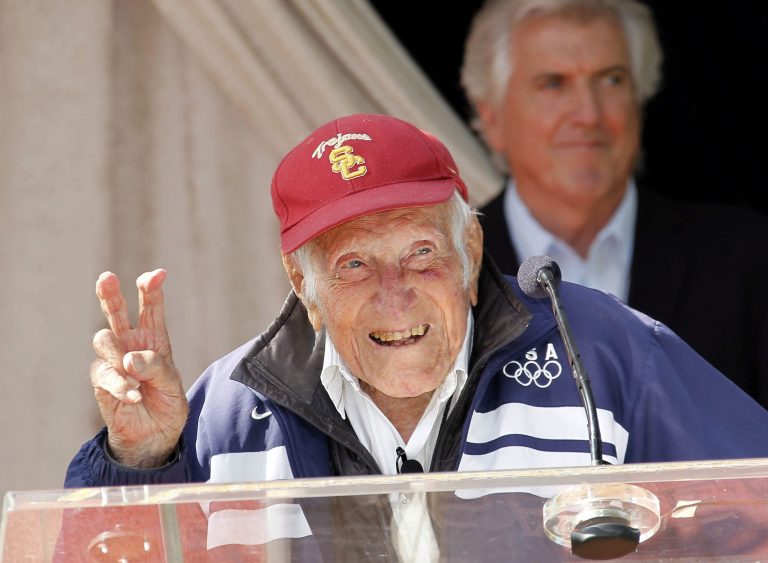 Louis Zamperini gestures during a news conference Friday May 9, 2014 in Pasadena, Calif. (AP Photo/Nick Ut)