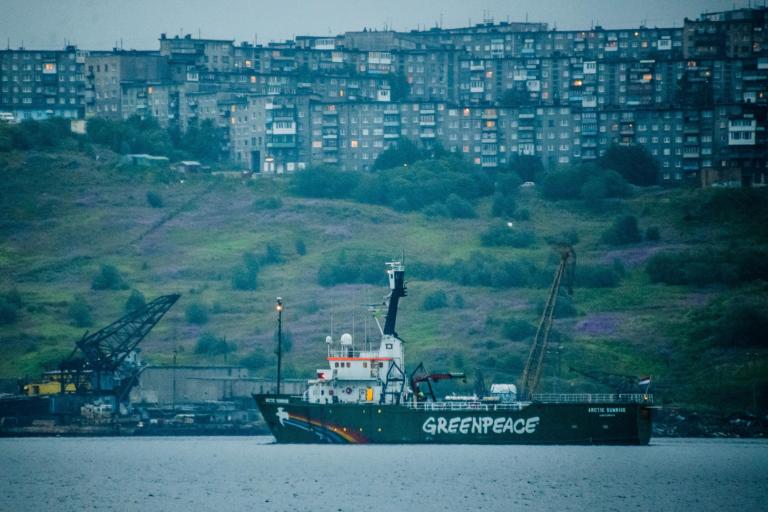 In this photo made available by Greenpeace International on Friday, Aug. 1, 2014, the Greenpeace ship Arctic Sunrise departs from Murmansk, Russia after it was held in the port by Russian authorities for eleven months. (AP Photo/ Vladimir  Baryshev, Greenpeace International)