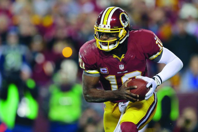 Matt Slocum/AP
NFL analysts and coaches seem to think limiting Robert Griffin III's ability to run once he recovers from his surgery doesn't make sense.