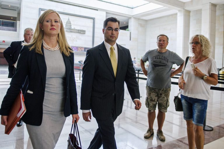 Bryan Pagliano, center, a former State Department employee who helped set up and maintain a private email server used by Hillary Rodham Clinton, departs Capitol Hill in Washington, Thursday, Sept. 10, 2015, to give his deposition to a House panel on the Benghazi investigation. (AP Photo/Cliff Owen)