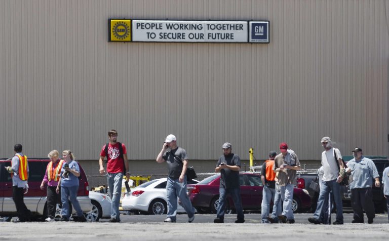 Employees evacuate the GM Marion Metal Center in Marion, Ind., following a chemical explosion Tuesday, July 1, 2014. One worker died and five more were taken to Marion General Hospital with non-life threatening injuries. (AP Photo/Chronicle-Tribune, Jeff Morehead)