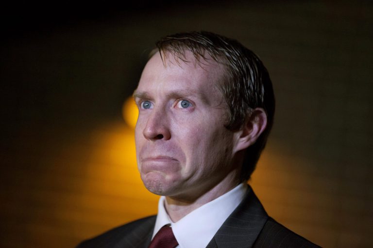   Robbie Parker, the father of six-year-old Emilie who was killed in the Sandy Hook Elementary School shooting, fights back tears as he speaks during a news conference, Saturday, Dec. 15, 2012, in Newtown, Conn. (AP Photo/David Goldman)  