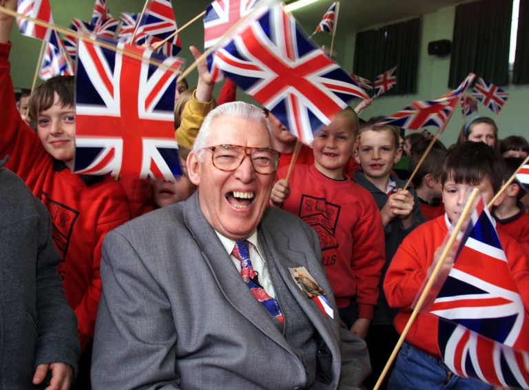 FILE - In this April 20, 1999 file photo former Democratic Unionist Party leader Ian Paisley laughs as he poses for a photo with school children. Paisley the fiery Protestant leader has died in Northern Ireland aged 88  his wife Eileen said Friday Sept. 12, 2014. (AP Photo/PA, Paul Faith) UNITED KINGDOM OUT NO SALES NO ARCHIVE