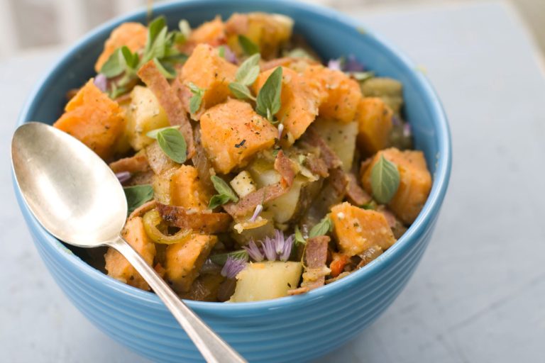   This image taken on May 14, 2012 ahows a recipe for Italian grinder potato salad prepared with sweet potatoes, cherry peppers, and sliced salami in Concord, N.H. (AP Photo/Matthew Mead)  