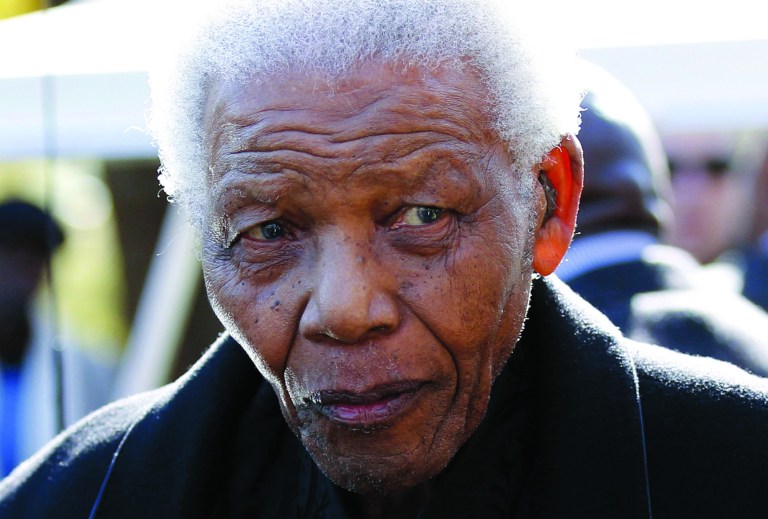 FILE - In this June 17, 2010 file photo, former South African President, Nelson Mandela leaves the chapel after attending the funeral of his great-granddaughter Zenani Mandela in Johannesburg, South Africa. Mandela was released Wednesday, Dec. 26, 2012 from the hospital after being treated for a lung infection and having gallstones removed, a government spokesman said. (AP Photo/Siphiwe Sibeko, Pool, File)