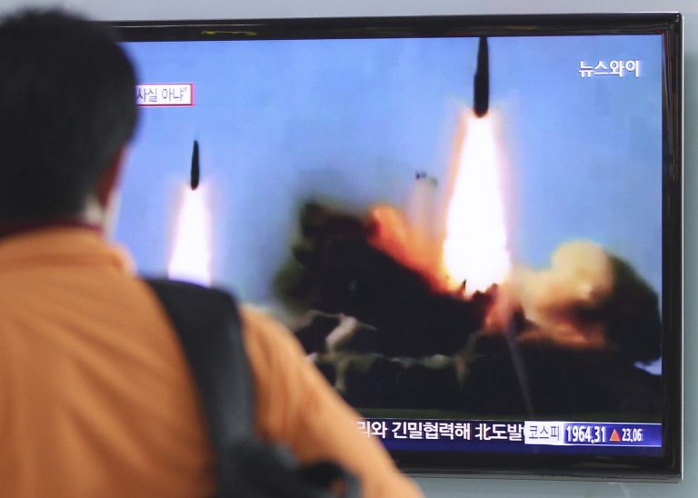 A man watches a TV news program showing the missile launch conducted by North Korea, at Seoul Railway Station in Seoul, South Korea, Wednesday, March 26, 2014. North Korea test-fired two medium-range ballistic missiles on Wednesday, South Korea and the U.S. said, a defiant challenge to a rare three-way summit of its rivals Seoul, Tokyo and Washington that focused on the North's security threat.(AP Photo/Ahn Young-joon)