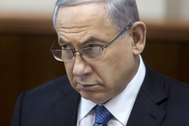 Israeli Prime Minister Benjamin Netanyahu listens during in his Cabinet meeting in his office in Jerusalem on Sunday, Nov. 23, 2014. (AP Photo/Jim Hollander, Pool)