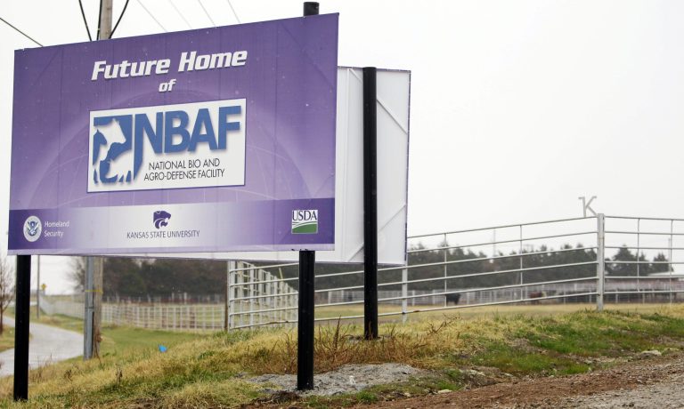   FILE - In this Nov. 17, 2010, a sign marks the future home of the National Bio and Agro-Defense Facility on the Kansas State University campus in Manhattan, Kan. The federal government still underestimates the risk of a planned biosecurity lab in Kansas releasing a dangerous animal disease, and an assessment earlier this year suggesting minimal danger is seriously flawed, an independent report said Friday, June 15, 2012. (AP Photo/Orlin Wagner)  