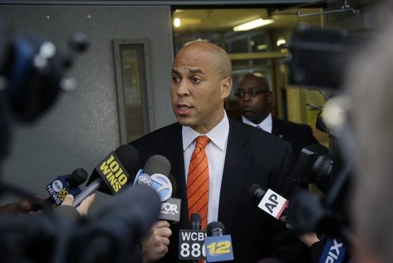 Newark Mayor and Senate candidate Cory Booker answers a question after he voted in a primary election Tuesday, Aug. 13, 2013, in Newark, N.J. Low turnout was expected Tuesday as New Jersey voters decide which candidates will run to fill the seat of the late U.S. Sen. Frank Lautenberg, who died in June. Democrat Booker and Republican Steve Lonegan are expected to easily win their party primaries. Barring an upset, the two will square off in an Oct. 16 special election, with the winner headed to Washington for the remaining 15 months of Lautenberg's term.  (AP Photo/Mel Evans)