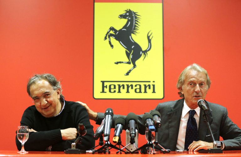 Fiat-Chrysler CEO Sergio Marchionne, left, and outgoing Ferrari President Luca Di Montezemolo attend a press conference in at the Ferrari headquarters in Maranello, Italy, Wednesday, Sept. 10, 2014. Fiat-Chrysler announced that Ferrari president Montezemolo will leave the company next month amid a disappointing season by the flagship Formula One team and before an imminent stock listing of merged parent company Fiat-Chrysler. The statement from Ferrari's parent company said Montezemolo will depart on Oct. 13 following Ferrari's 60th anniversary celebration of sales in the United States. Fiat-Chrysler CEO Sergio Marchionne will take on the Ferrari job in the immediate term. (AP Photo/Antonio Calanni)