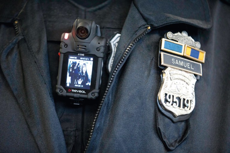 A Philadelphia Police officer demonstrates a body-worn camera being used as part of a pilot project in the department's 22nd District in Philadelphia. (AP Photo/Matt Rourke)