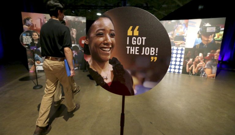 Job seekers walk into the Opportunity Fair and Forum employment event in Dallas. 