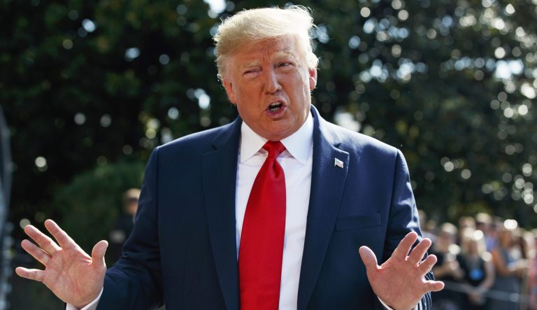 President Donald Trump talks to reporters on the South Lawn of the White House, Friday, Aug. 9, 2019.