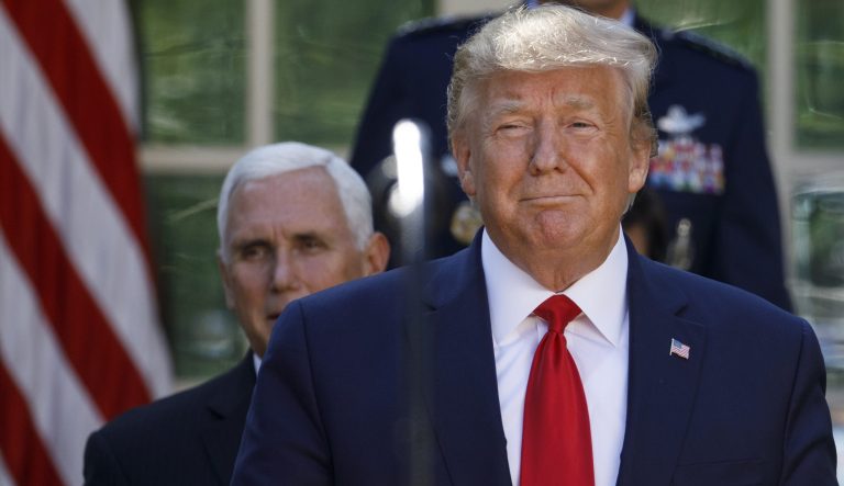 President Donald Trump arrives with Vice President Mike Pence, and Gen. John "Jay" Raymond, for a ceremony.
