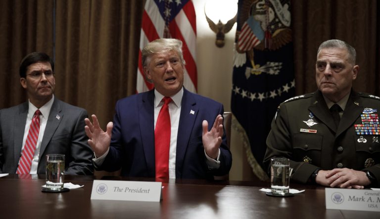 President Donald Trump, joined by, from left, Defense Secretary Mark Esper and Chairman of the Joint Chiefs of Staff Gen. Mark Milley, speaks to the media during a briefing with senior military leaders in the Cabinet Room at the White House.