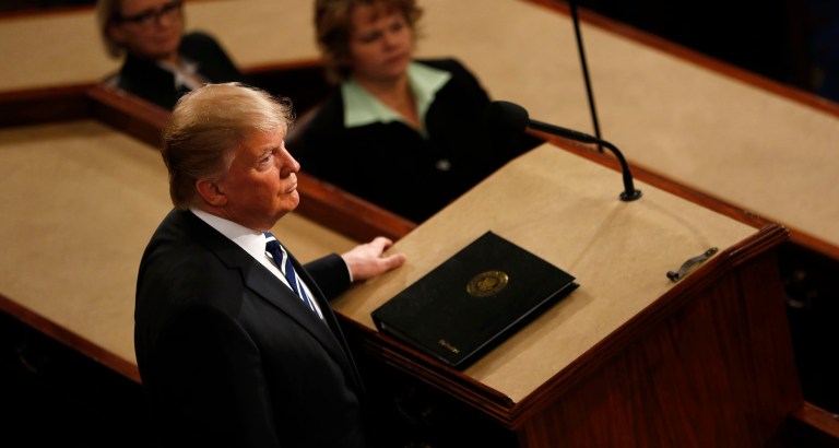 President Trump once again defied predictions that he was going to soften his position on immigration, this time during his first address to Congress on Tuesday night. (Aaron P. Bernstein/Bloomberg)