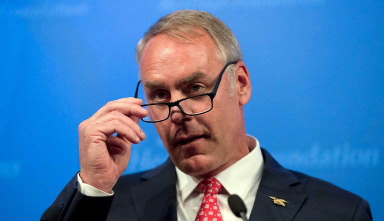 A watchdog group asked the Interior Department's inspector general on Friday to investigate whether Secretary Ryan Zinke violated the law by chartering private planes for purposes that may represent conflicts of interest. (AP Photo/Andrew Harnik)