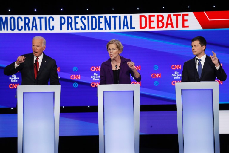 Democratic presidential candidate former Vice President Joe Biden, left, Sen. Elizabeth Warren, D-Mass., middle, and South Bend Mayor Pete Buttigieg participate in a Democratic presidential primary debate hosted by CNN/New York Times at Otterbein University, Tuesday, Oct. 15, 2019, in Westerville, Ohio. 