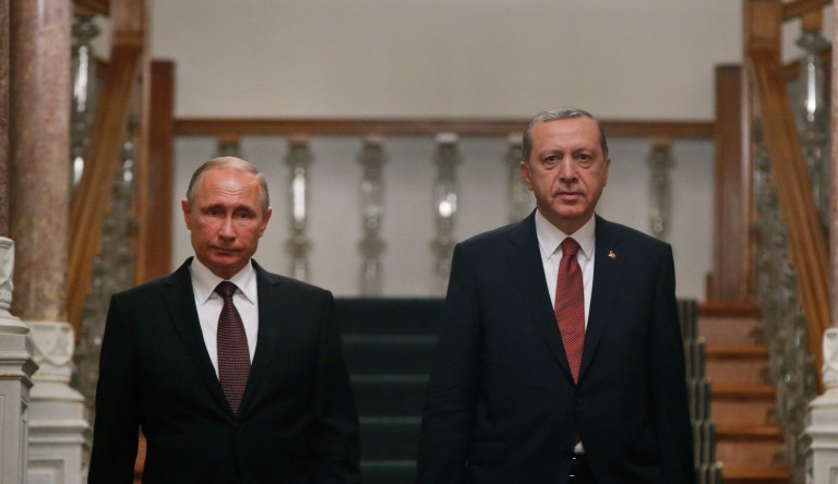 Russian President Vladimir Putin, right, and Turkish President Recep Tayyip Erdogan shake hands after their joint news conference following the talks in the Bocharov Ruchei residence in the Black Sea resort of Sochi in Sochi, Russia, Monday, Sept. 17, 2018.