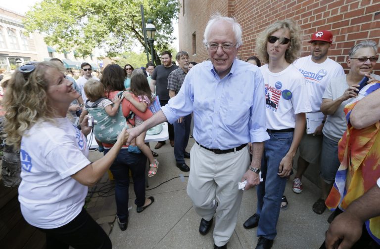 Democratic presidential candidate, Sen. Bernie Sanders, I-Vt., greets a supporter during the opening of his Cedar Rapids field headquarters, Sunday, Aug. 16, 2015, in Marion, Iowa. (AP Photo/Charlie Neibergall)