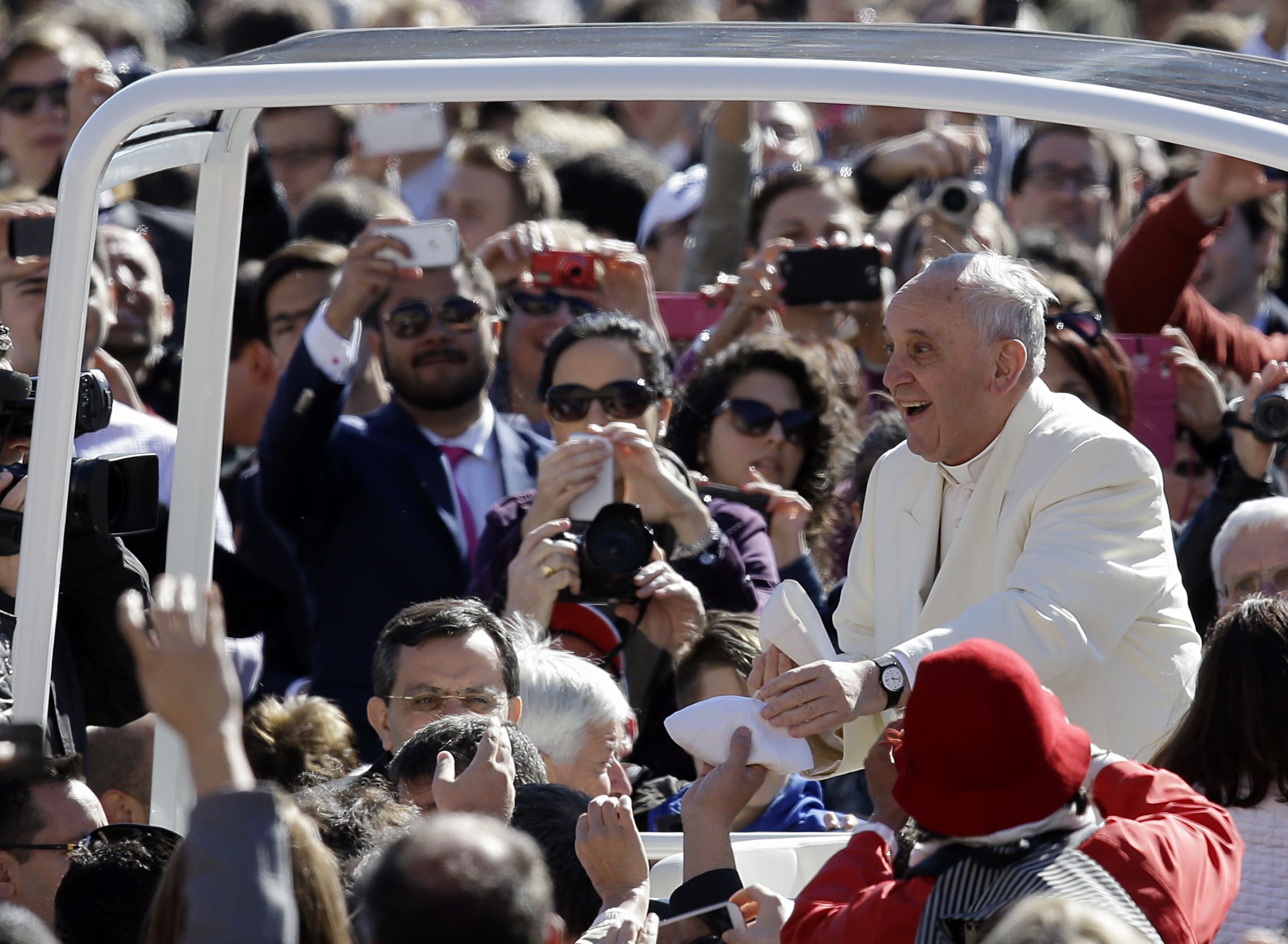 Pope gives a lift to 2 kids in St. Peter’s Square