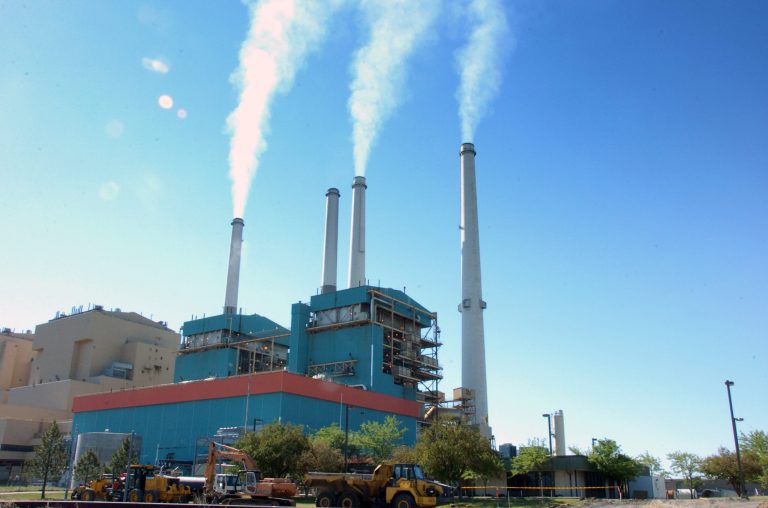 Smoke rises from the Colstrip Steam Electric Station, a coal-burning power plant in Colstrip, Mont., on July 1. (AP Photo/Matthew Brown)