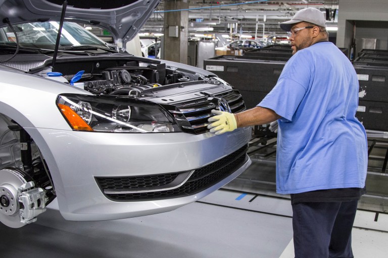 An employee at the Volkswagen plant in Chattanooga, Tenn., works on the assembly of a Passat sedan. (AP/Erik Schelzig)