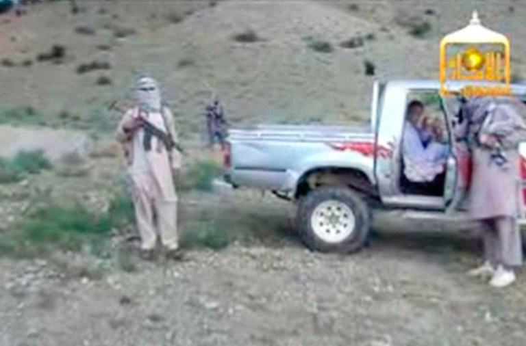 In this Image taken from video obtained from the Voice Of Jihad Website, which has been authenticated based on its contents and other AP reporting, Sgt. Bowe Bergdahl sits in a vehicle guarded by the Taliban in eastern Afghanistan.(AP Photo/Voice Of Jihad Website via AP video)