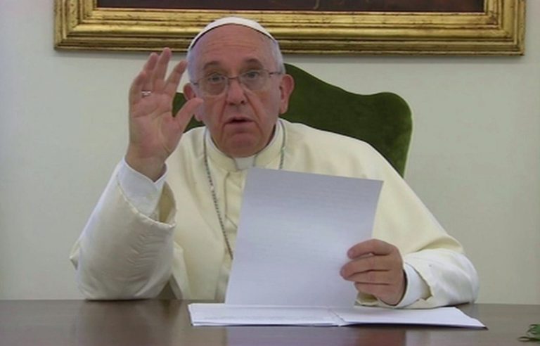 In this image from video, Pope Francis records a video message to camera, Thursday June 12, 2014, giving a message for the soccer World Cup: Let football be a showcase for teamwork and solidarity, not an exhibition of racism and greed, Pope Francis says 