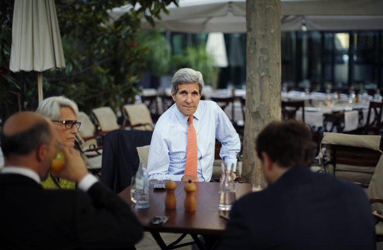 Secretary of State John Kerry, U.S. Under Secretary for Political Affairs Wendy Sherman, second from left,, National Security Council point person on the Middle East Robert Malley and Chief of Staff Jon Finer, right, meet on the terrace of a hotel where the Iran nuclear talks meetings are being held in Vienna, Austria, Thursday, July 2, 2015. (Carlos Barria/Pool via AP)