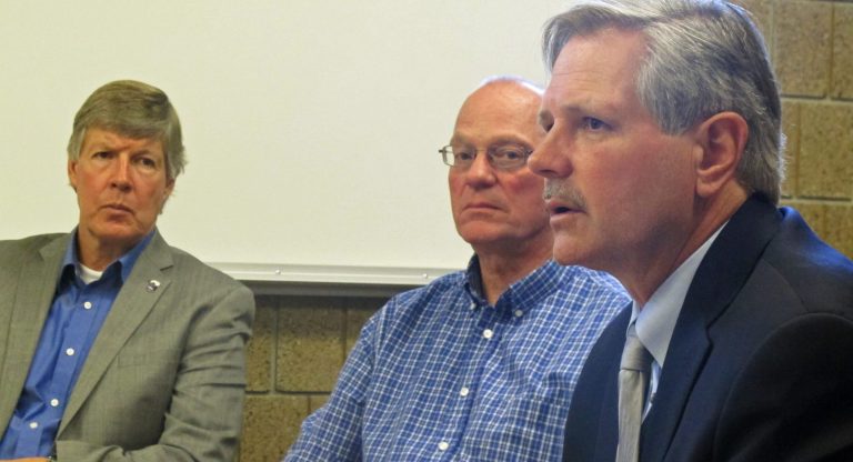 American Crystal Sugar Co. CEO Dave Berg, left, and Roger Weinlaeder of the North Dakota Farm Credit Council, center, listen to Sen. John Hoeven, R-North Dakota, talk about passing a 2013 farm bill during a meeting at North Dakota State University in Fargo, N.D., on Wednesday. (AP/Dave Kolpack)