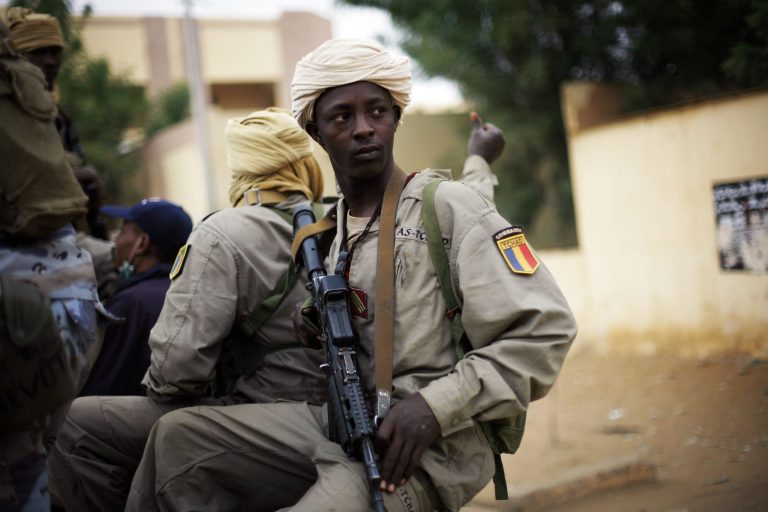 FILE -- In this picture taken Monday Jan. 28, 2013, Chadian soldiers patrol the streets of Gao, Northern Mali. Chadian President Idriss Deby in an interview with French journalists that was posted online Monday April 15, 2013 said his country's troops are pulling out of Mali three months after the French-led mission to oust al-Qaida-linked militants began, raising concerns about the future of war in the absence of the fierce Chadian desert fighters. The drawdown of Chadian forces comes days after a suicide bombing killed three Chadian soldiers.(AP Photo/Jerome Delay-File)