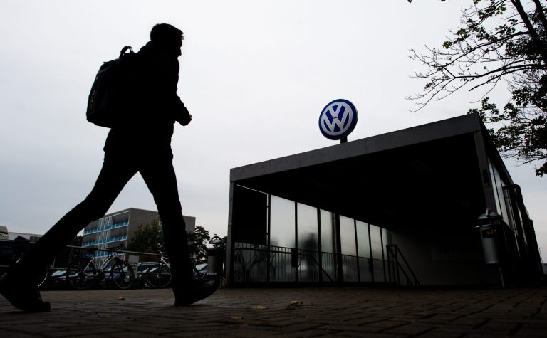 A VW employee enters the Volkswagen factory in Wolfsburg, Germany, Oct. 6, 2015.Â German prosecutors, said their raid targeted documents, computers and data storage devices that would help in the country's investigation into the automaker'sÂ attempt to cheat emission regulations and consumers.Â (Julian Stratenschulte/dpa via AP)