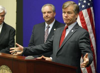 Virginia Gov. Bob McDonnell gestures during a news conference with Lt. Gov Bill Bolling, left, at the Capitol in Richmond, Va., Wednesday, Nov. 9, 2011.