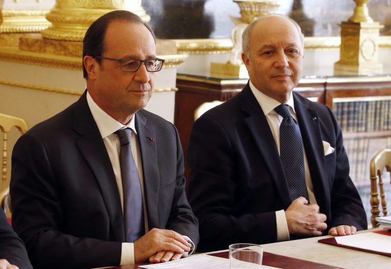 French President Francois Hollande, left, and French Foreign Minister Laurent Fabius chair a meeting at the Elysee Palace in Paris, France, Thursday, June 24, 2015. Appearing more irritated and embarrassed than surprised, France's government summoned the U.S. ambassador Wednesday to respond to Wikileaks revelations that the NSA eavesdropped on three successive presidents and other top officials. (Charles Platiau, Pool via AP)