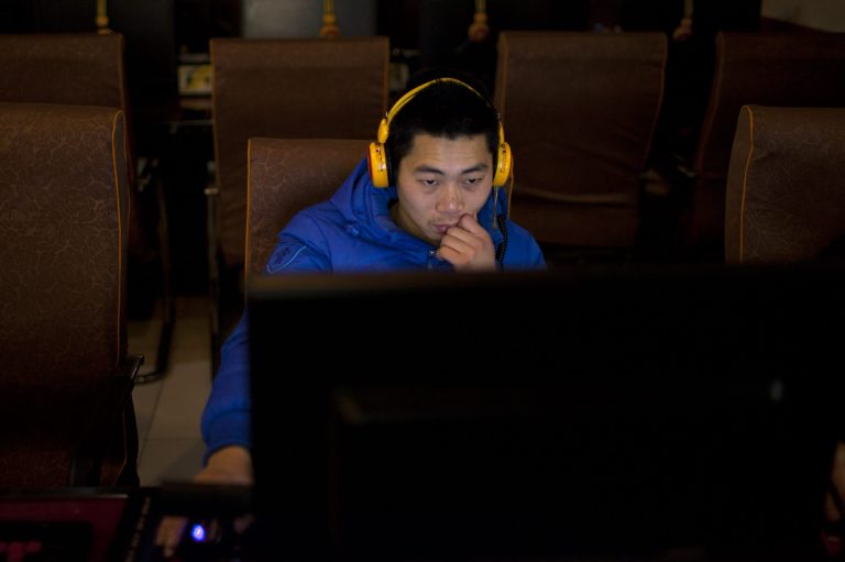   A man uses a computer at an internet cafe in central Beijing, China, Friday, Dec. 28, 2012. China's new communist leaders are increasing already tight controls on Internet use and electronic publishing following a spate of embarrassing online reports about official abuses. (AP Photo/Alexander F. Yuan)  