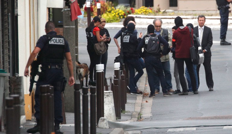 The Paris prosecutor's office says two people have been detained after a possible explosives laboratory was discovered in a suburb south of Paris. (AP Photo/Christophe Ena)