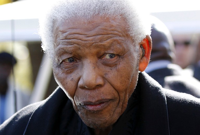   FILE - In this June 17, 2010 file photo, former South African President, Nelson Mandela leaves the chapel after attending the funeral of his great-granddaughter Zenani Mandela in Johannesburg, South Africa. Mandela was released Wednesday, Dec. 26, 2012 from the hospital after being treated for a lung infection and having gallstones removed, a government spokesman said. (AP Photo/Siphiwe Sibeko, Pool, File)  