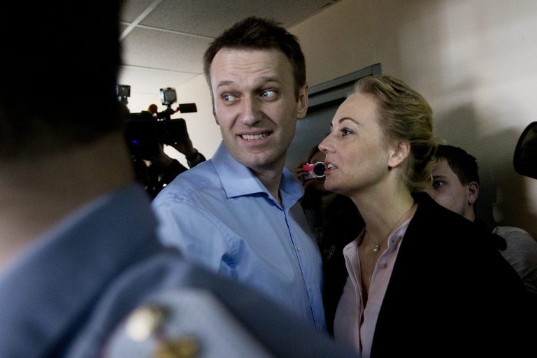 Russian opposition activist and anti-corruption crusader Alexei Navalny, centre, and his wife Yulia, right, enter a courtroom before the start of a trial against Alexei and his brother Oleg Navalny, in Moscow, Russia, Thursday, April 24, 2014.  The brothers face charges of allegedly laundering some millions of rubles from French cosmetics company Yves Rocher. (AP Photo/Pavel Golovkin)