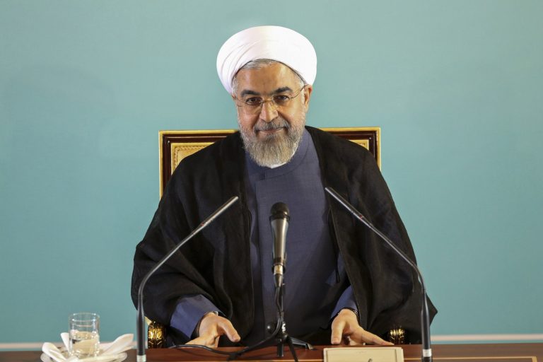 Iranian President Hassan Rouhani gives a press conference in Tehran, Iran, Saturday, Aug. 30, 2014.  Rouhani called Western sanctions an "invasion" on Saturday after Washington imposed existing sanctions on more than 25 businesses, banks and individuals suspected of working to expand Iran's nuclear program, support terrorism and help Iran evade U.S. and international sanctions. Iran's state TV also said the move violated an interim agreement reached with world powers under which Western nations agreed to ease sanctions in exchange for Iran curbing its nuclear activities.  However, Friday's action did not constitute an expansion of the sanctions regime.