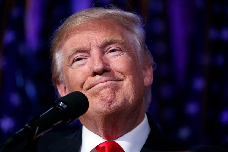 President-elect Donald Trump smiles as he arrives to speak at an election night rally in New York. (AP Photo/ Evan Vucci)