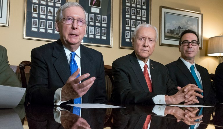 In this Nov. 9, 2017, photo, from left, Senate Majority Leader Mitch McConnell, R-Ky., Senate Finance Committee Chairman Orrin Hatch, R-Utah, and Treasury Secretary Steven Mnuchin, speak to reporters as work gets underway on the Senate's version of the GOP tax reform bill, on Capitol Hill in Washington. (AP Photo/J. Scott Applewhite)
