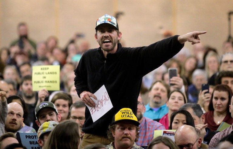 It mirrored early Tea Party protests that overtook town hall meetings across the country in 2009. (AP Photo/Rick Bowmer)