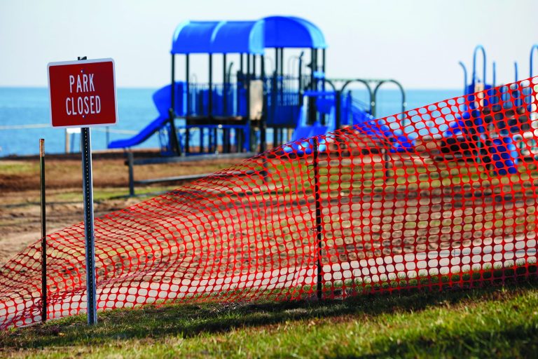 In this photo taken Thursday, Dec. 13, 2012, a recreational area is fenced off in an area where high levels of lead were recorded following Superstorm Sandy in Laurence Harbor, N.J. Federal and state officials say Sandy's floodwaters didn't cause problems at any of the 147 toxic waste or Superfund sites in the New York/New Jersey area. The Environmental Protection Agency says there's no immediate threat to public health. But some experts say the storm created thousands of small pollution sites that could be even more challenging to track and clean up. (AP Photo/Julio Cortez)