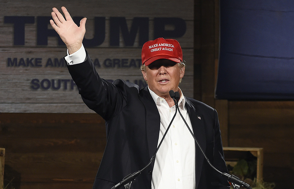 Trump brings back the hat for barn event