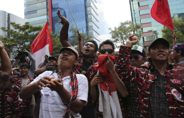 Indonesian protesters throw eggs during a demonstration outside Australian Embassy in Jakarta, Friday, Nov. 22, 2013. Indonesia has 